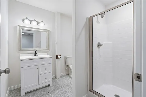 a bathroom with a sink a mirror and a shower