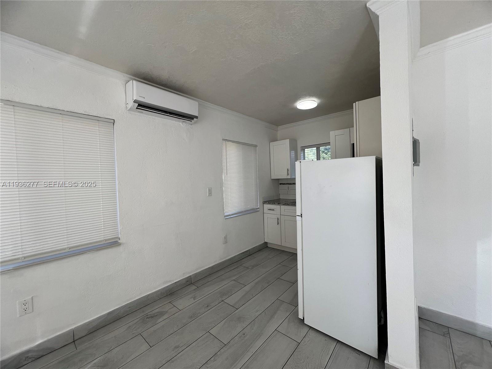 159 Northeast 75th Street, Unit 1 Miami, FL 33138 - Photo 3 of 8 a view of a storage & utility room with a refrigerator