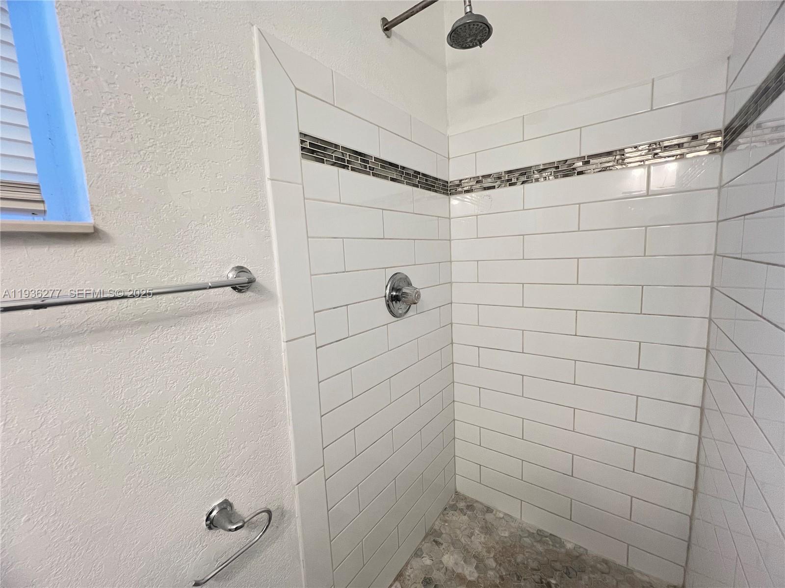 159 Northeast 75th Street, Unit 1 Miami, FL 33138 - Photo 5 of 8 a bathroom with a shower