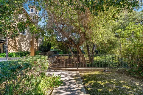 a view of house with outdoor space and deck