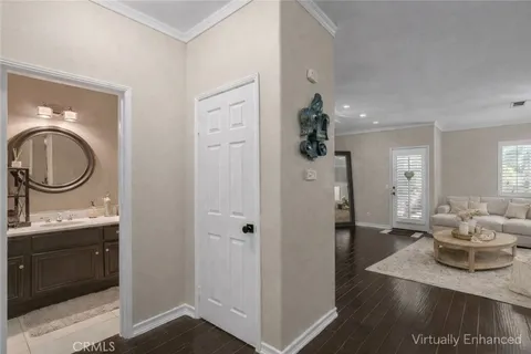 a kitchen with stainless steel appliances a table chairs refrigerator and microwave