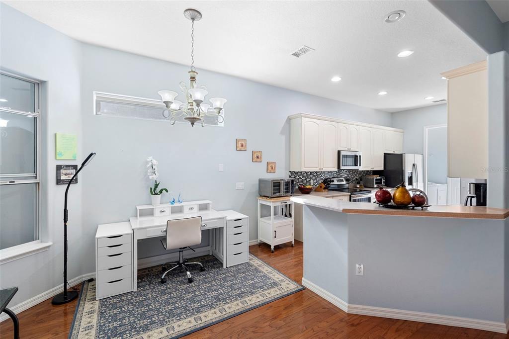 440 Sotheby Way DeBary, FL 32713 - Photo 17 of 37 a room with furniture a rug and white walls