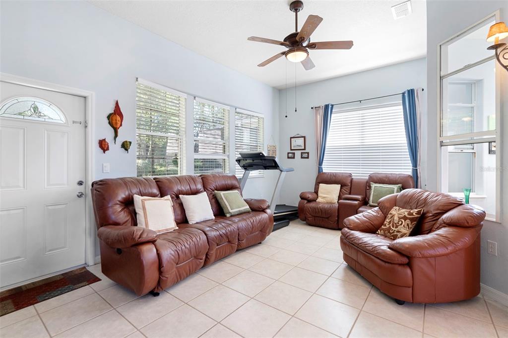 440 Sotheby Way DeBary, FL 32713 - Photo 21 of 37 a living room with furniture and a large window