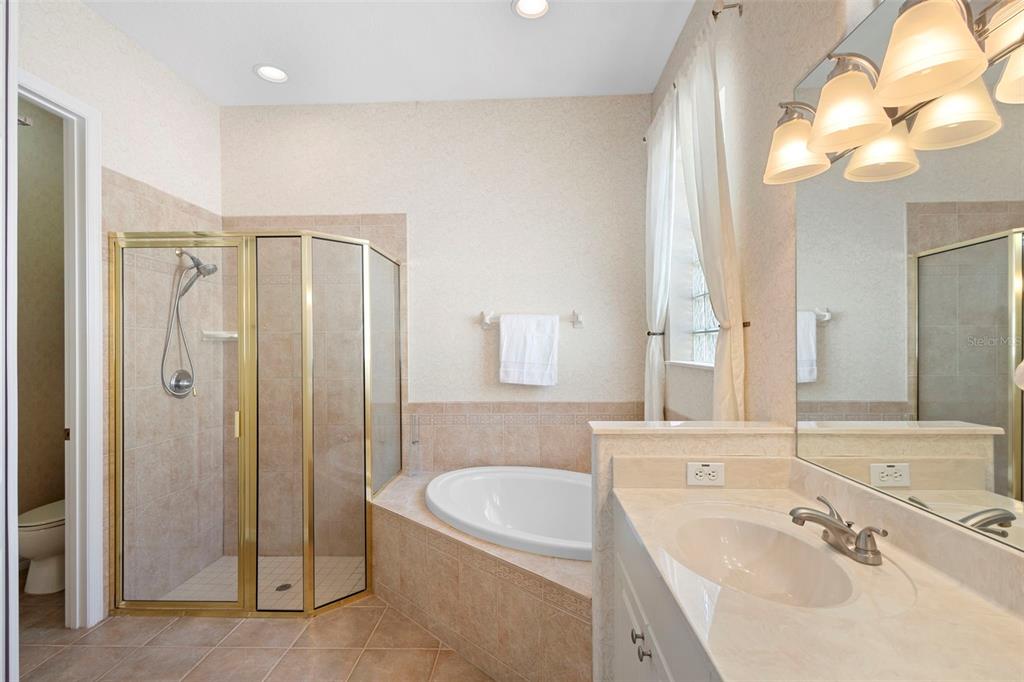440 Sotheby Way DeBary, FL 32713 - Photo 24 of 37 a bathroom with a sink a toilet and shower