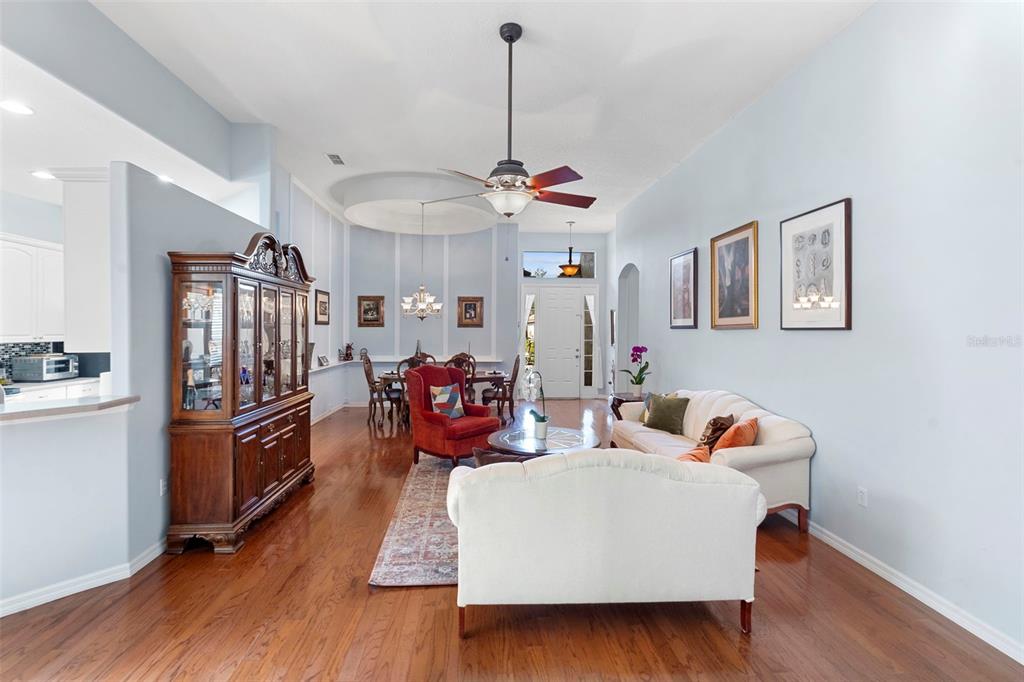 440 Sotheby Way DeBary, FL 32713 - Photo 8 of 37 a living room with furniture and a chandelier