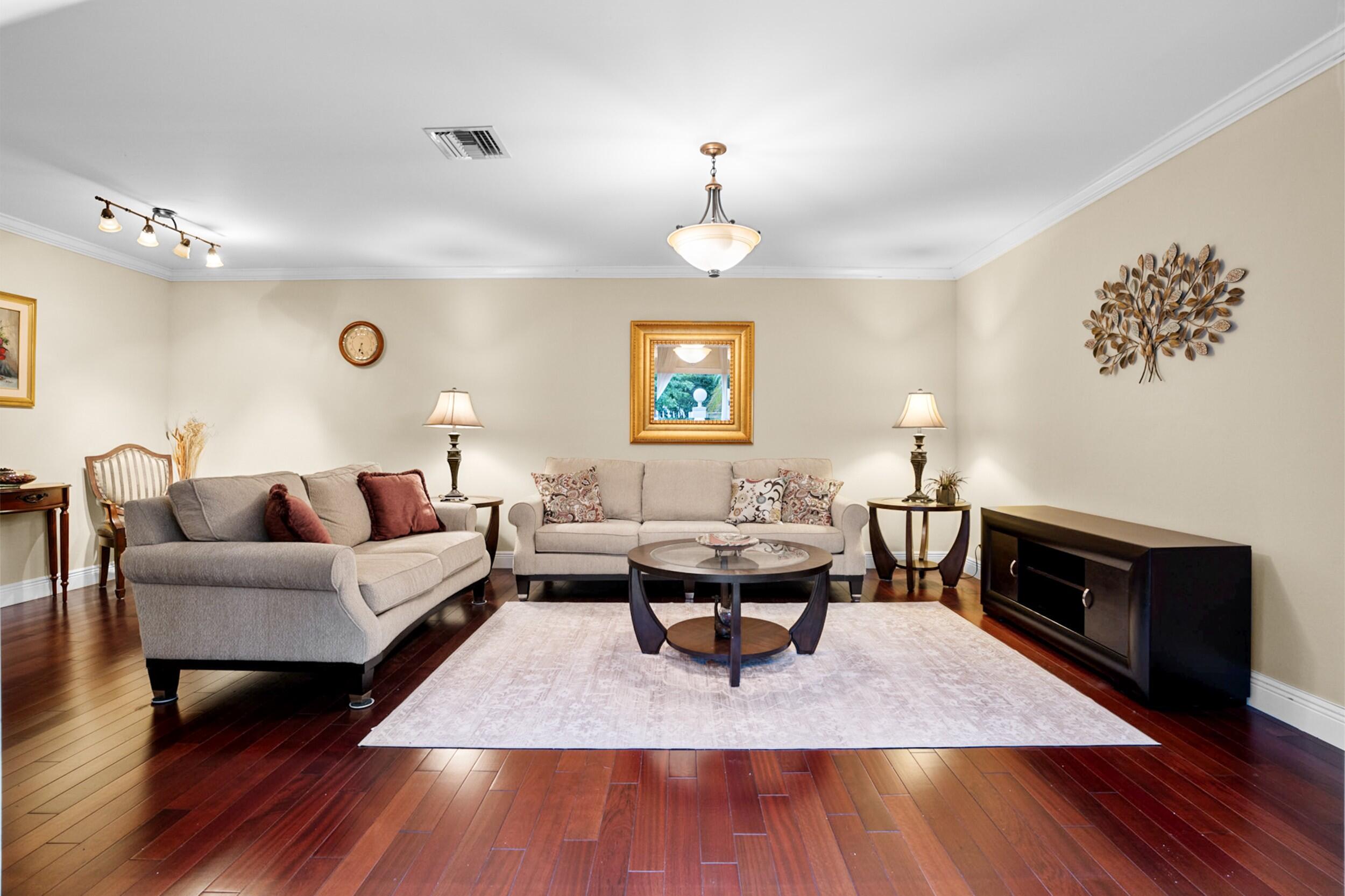 11181 Nautilus Drive Cooper City, FL 33026 - Photo 3 of 16 a living room with furniture rug and window