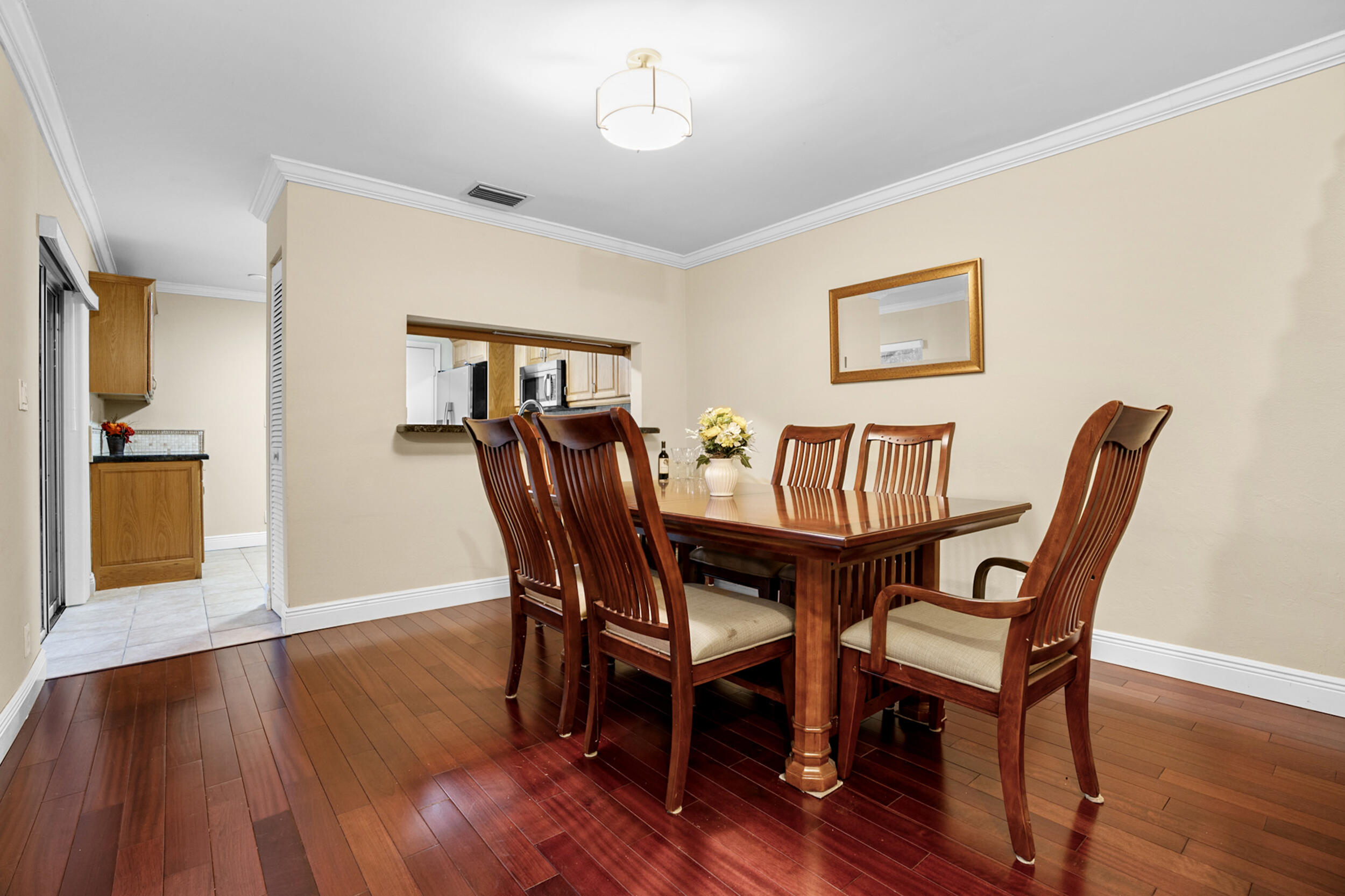 11181 Nautilus Drive Cooper City, FL 33026 - Photo 5 of 16 a view of a dining room with furniture and wooden floor