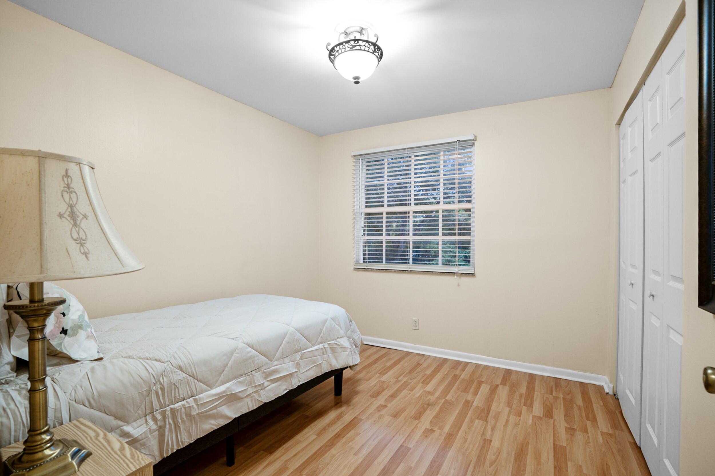 11181 Nautilus Drive Cooper City, FL 33026 - Photo 9 of 16 a bedroom with a bed and a window