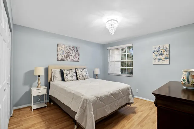 a bedroom with a bed and a table in it