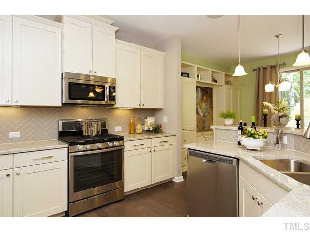 2421 Pilsley Road Apex, NC 27539 - Photo 12 of 25 (Photo of like model home. Actual options/colors may vary. Ask onsite agent for details.) Kitchen