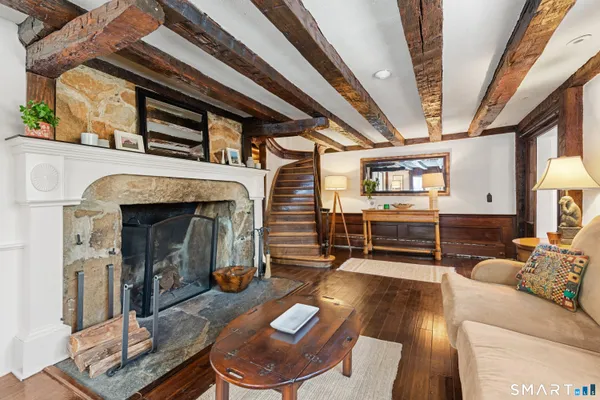 a view of a kitchen with cabinets and wooden floor