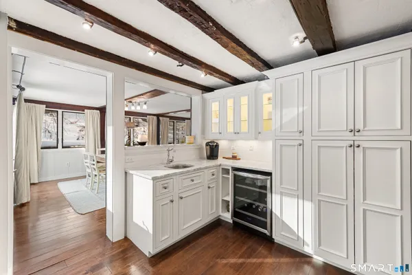a kitchen with a refrigerator and a sink