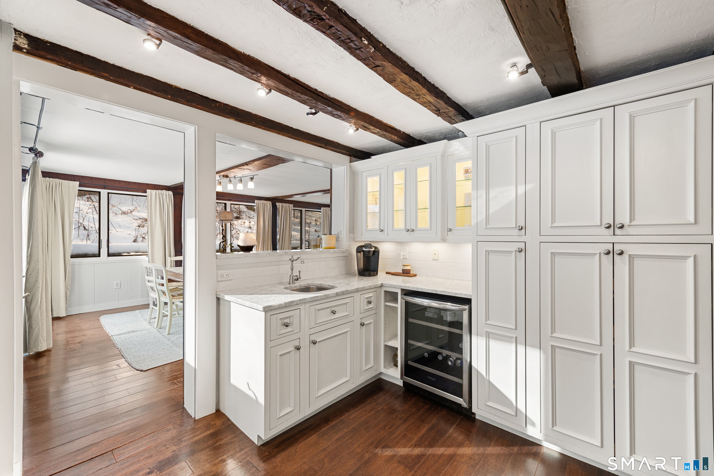 138 Putnam Park Road Bethel, CT 06801 - Photo 13 of 40 a view of a kitchen with cabinets and wooden floor