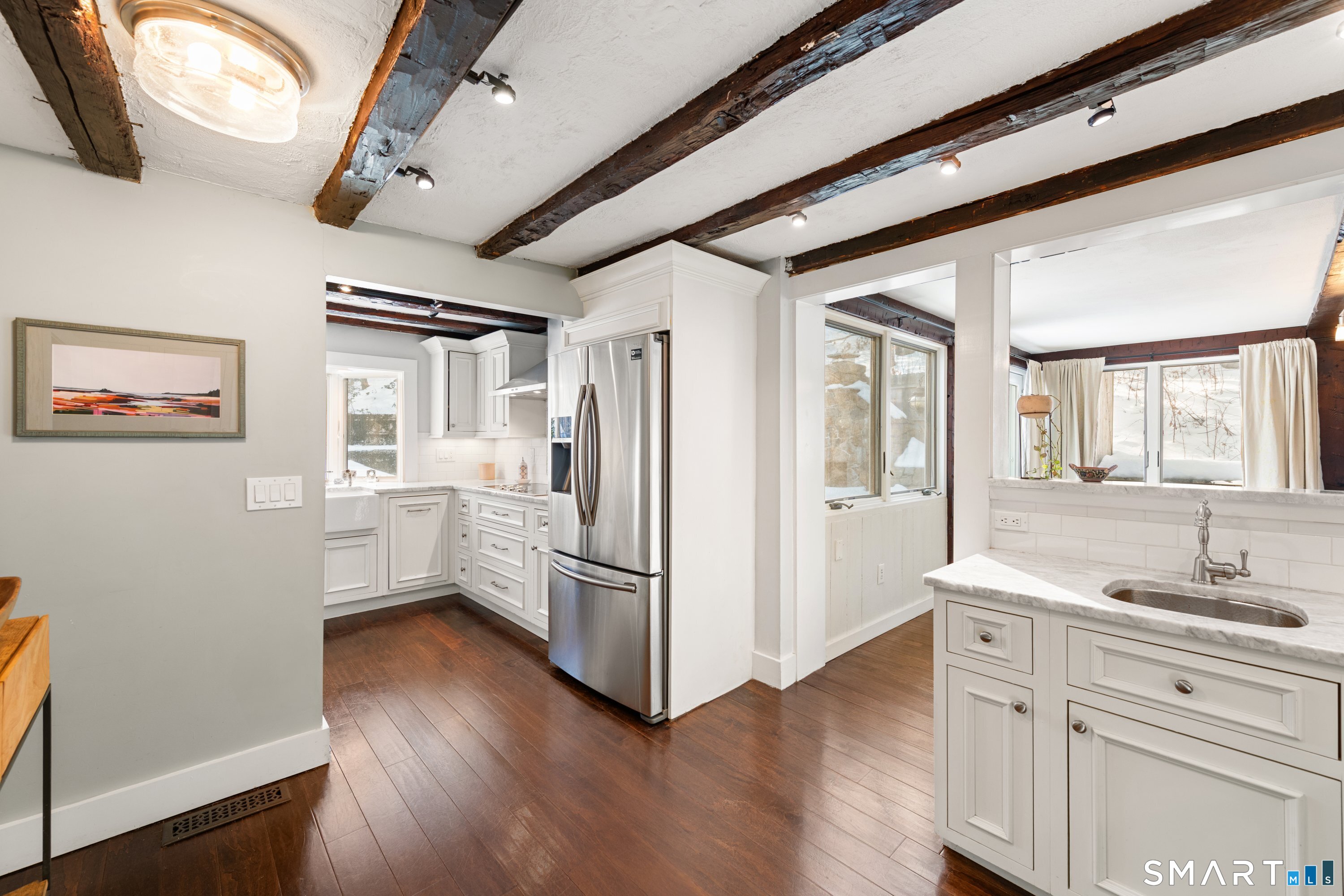 138 Putnam Park Road Bethel, CT 06801 - Photo 14 of 40 a kitchen with a refrigerator and a sink
