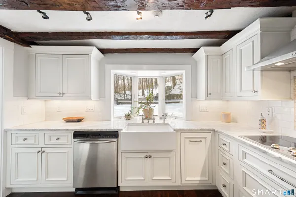 a kitchen with stove and refrigerator