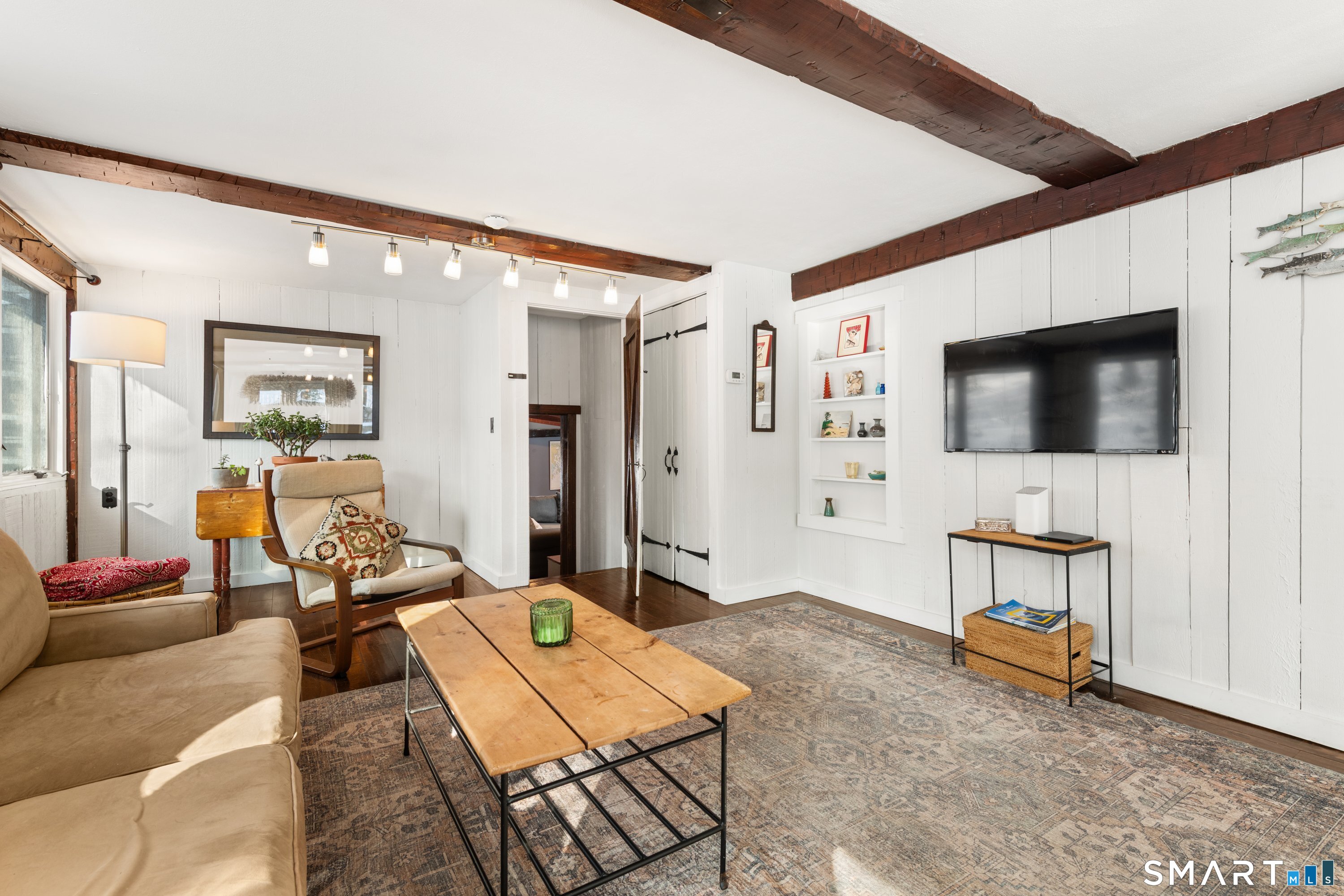 138 Putnam Park Road Bethel, CT 06801 - Photo 21 of 40 a living room with furniture and a flat screen tv
