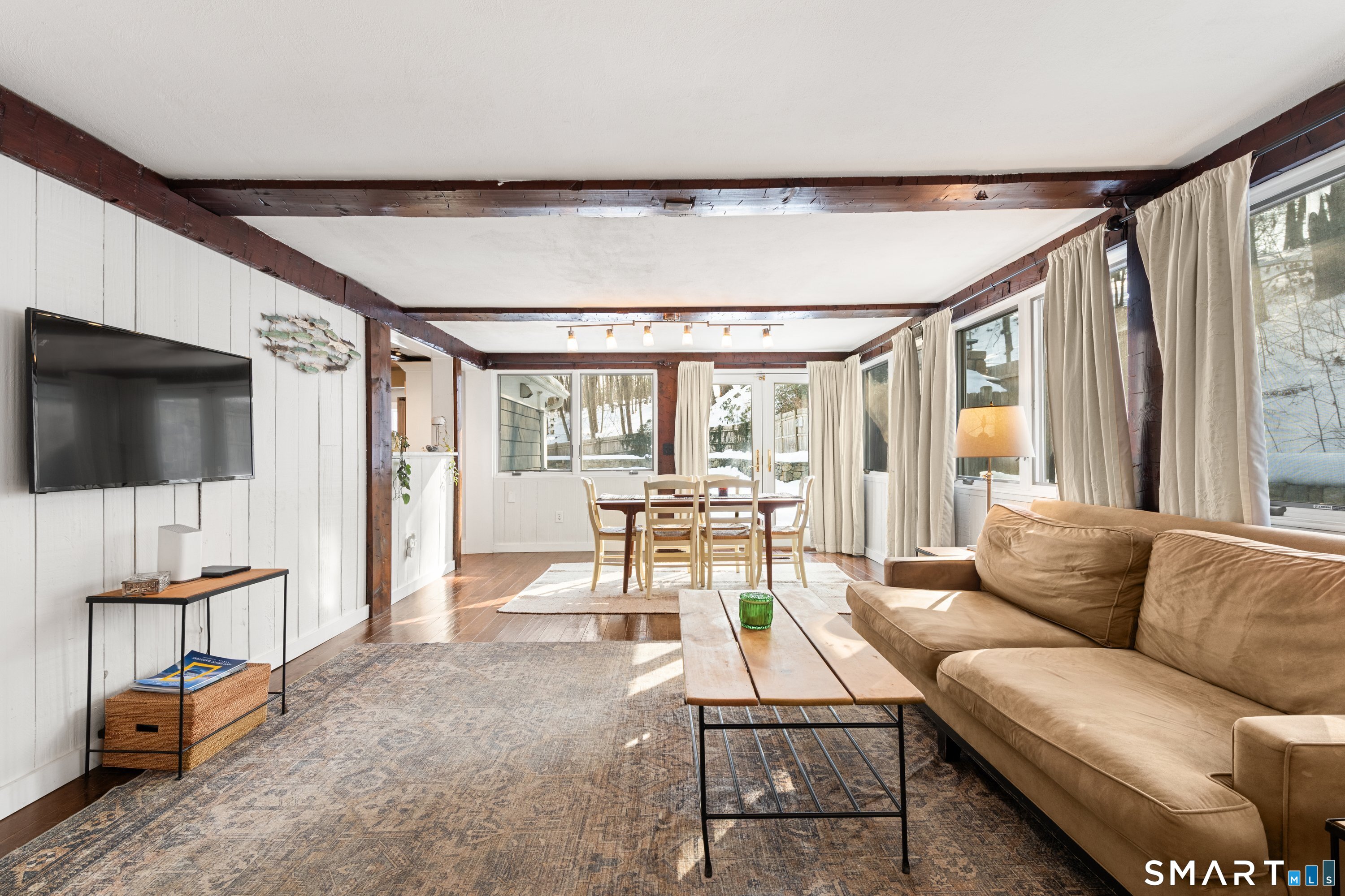 138 Putnam Park Road Bethel, CT 06801 - Photo 22 of 40 a living room with furniture and a flat screen tv