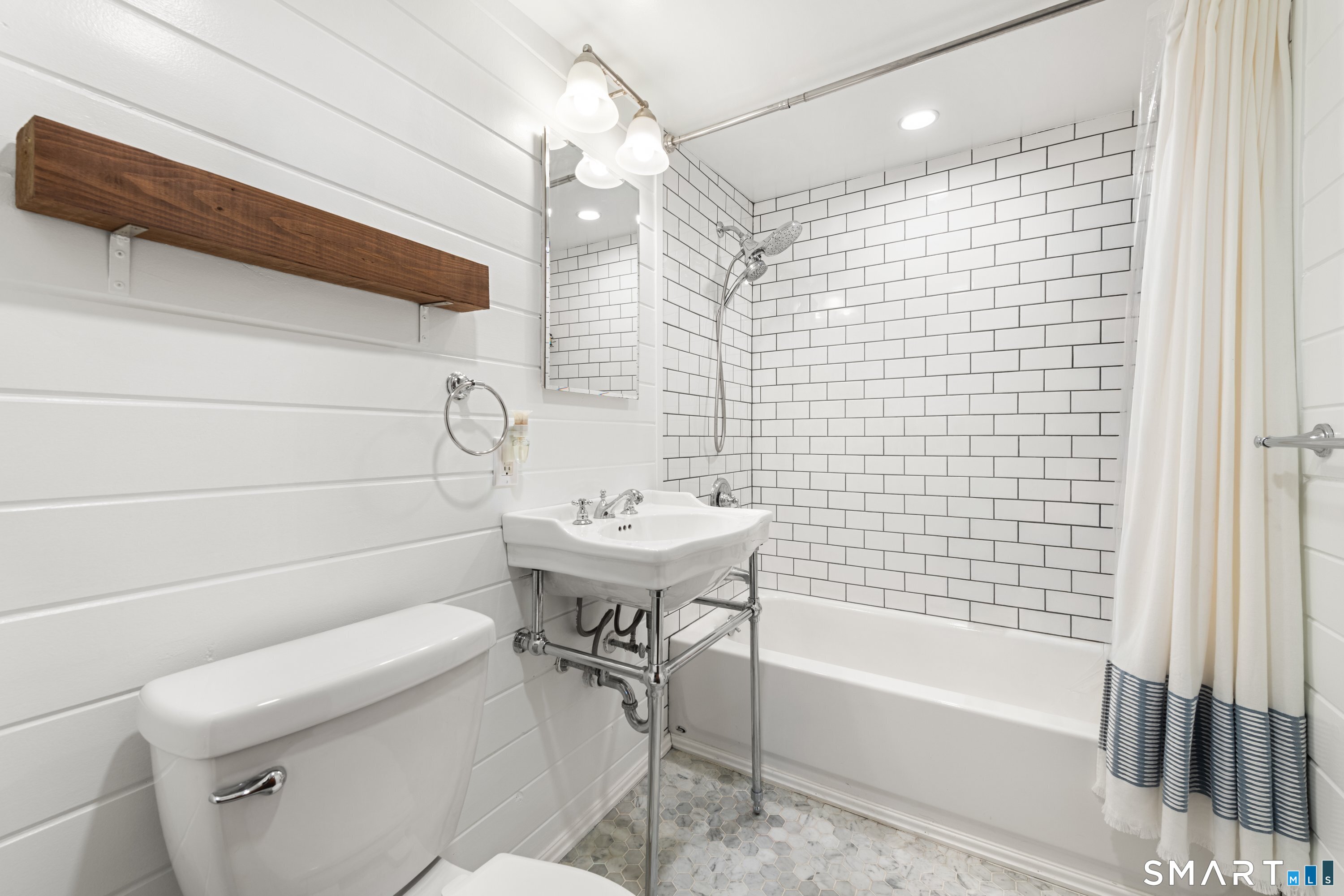 138 Putnam Park Road Bethel, CT 06801 - Photo 26 of 40 a bathroom with a sink a toilet and bathtub