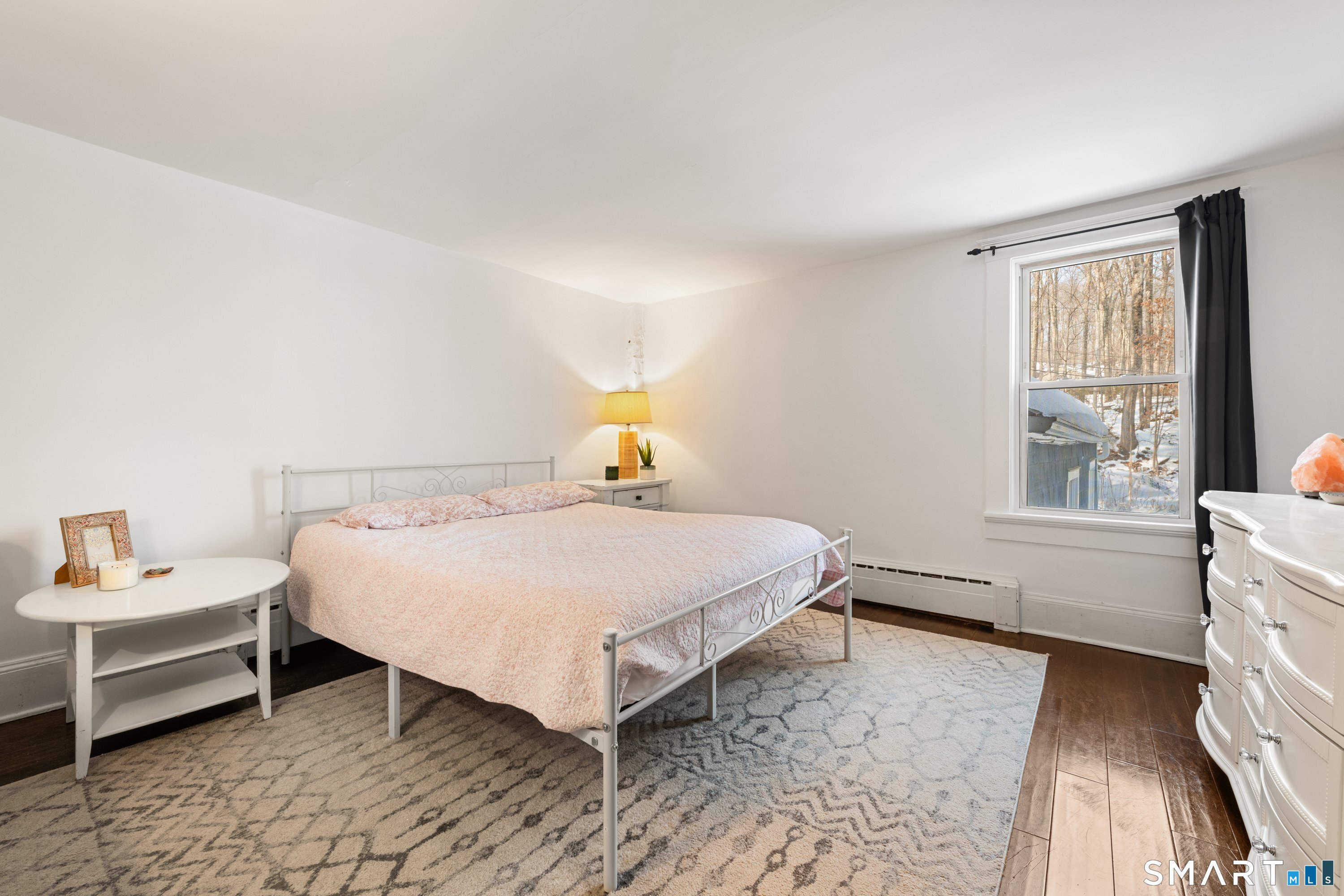 138 Putnam Park Road Bethel, CT 06801 - Photo 27 of 40 a bedroom with a bed and window