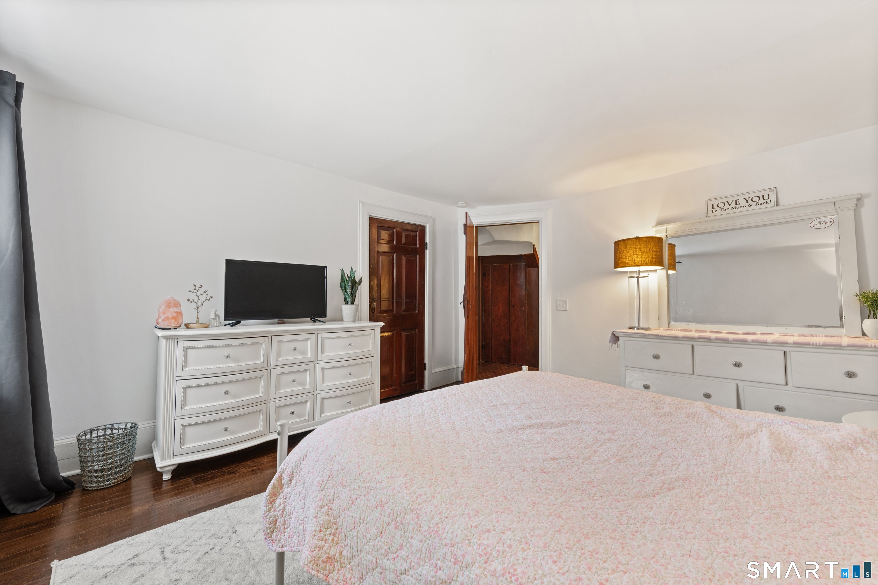 138 Putnam Park Road Bethel, CT 06801 - Photo 28 of 40 a bedroom with a bed and a flat screen tv