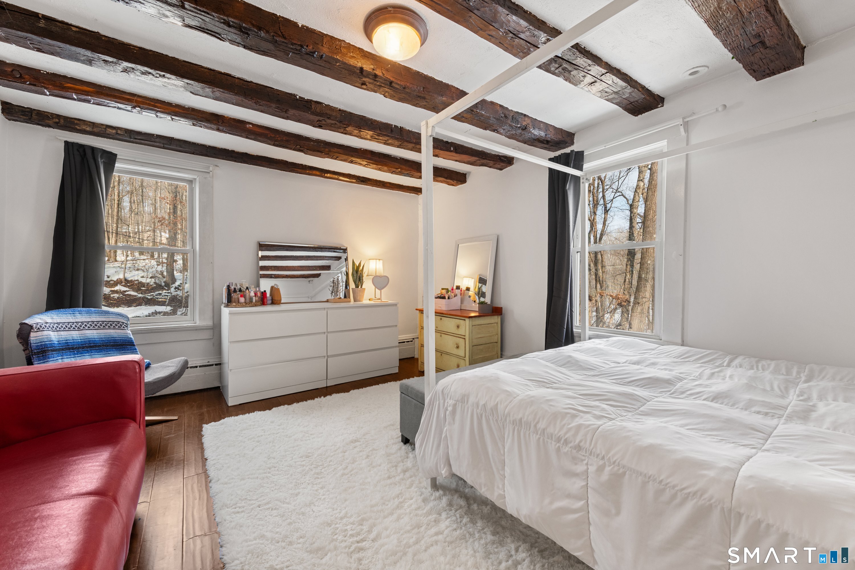 138 Putnam Park Road Bethel, CT 06801 - Photo 29 of 40 a bedroom with a large bed and a window