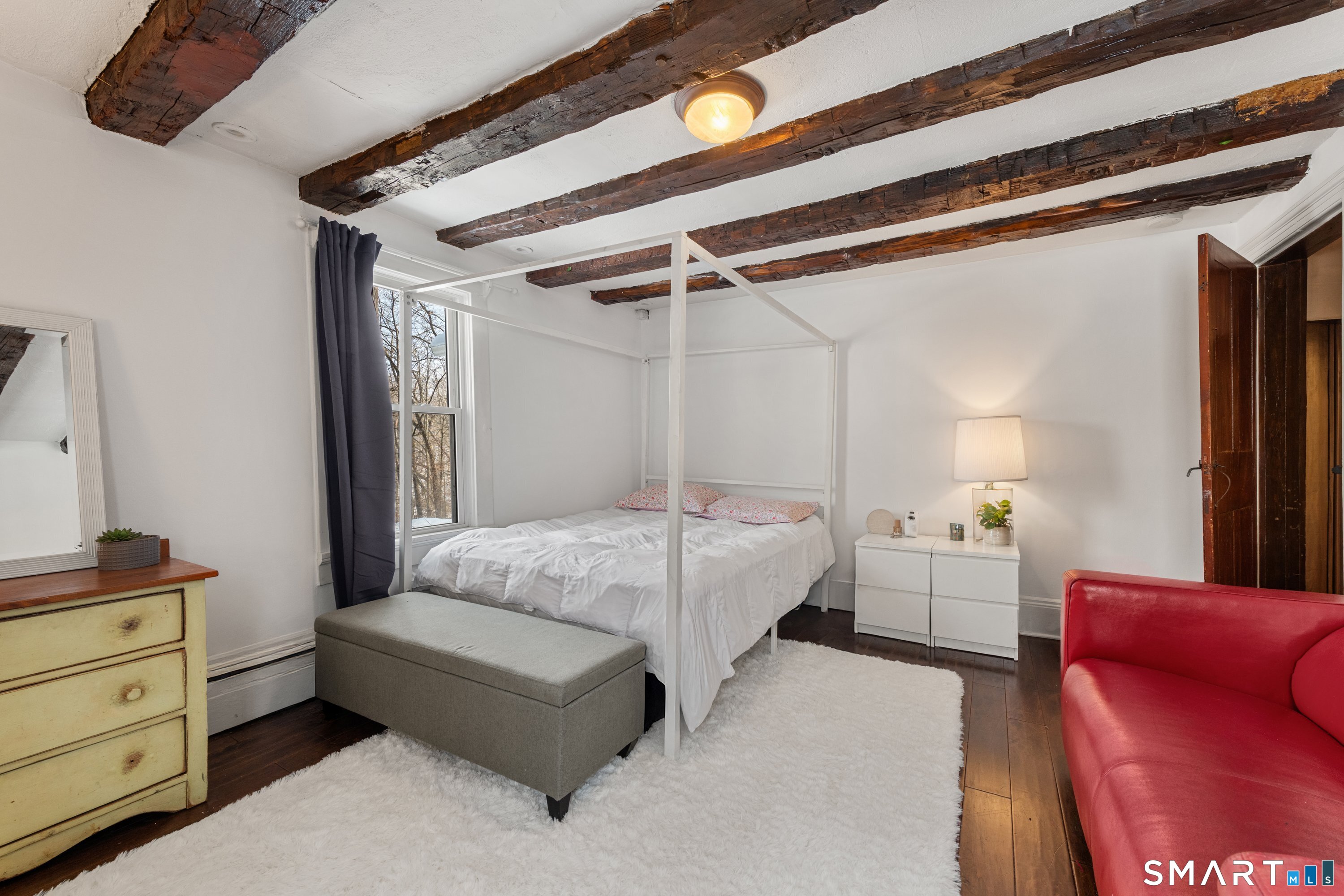 138 Putnam Park Road Bethel, CT 06801 - Photo 30 of 40 a bedroom with a bed couch and a window