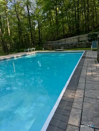 a view of swimming pool with a yard