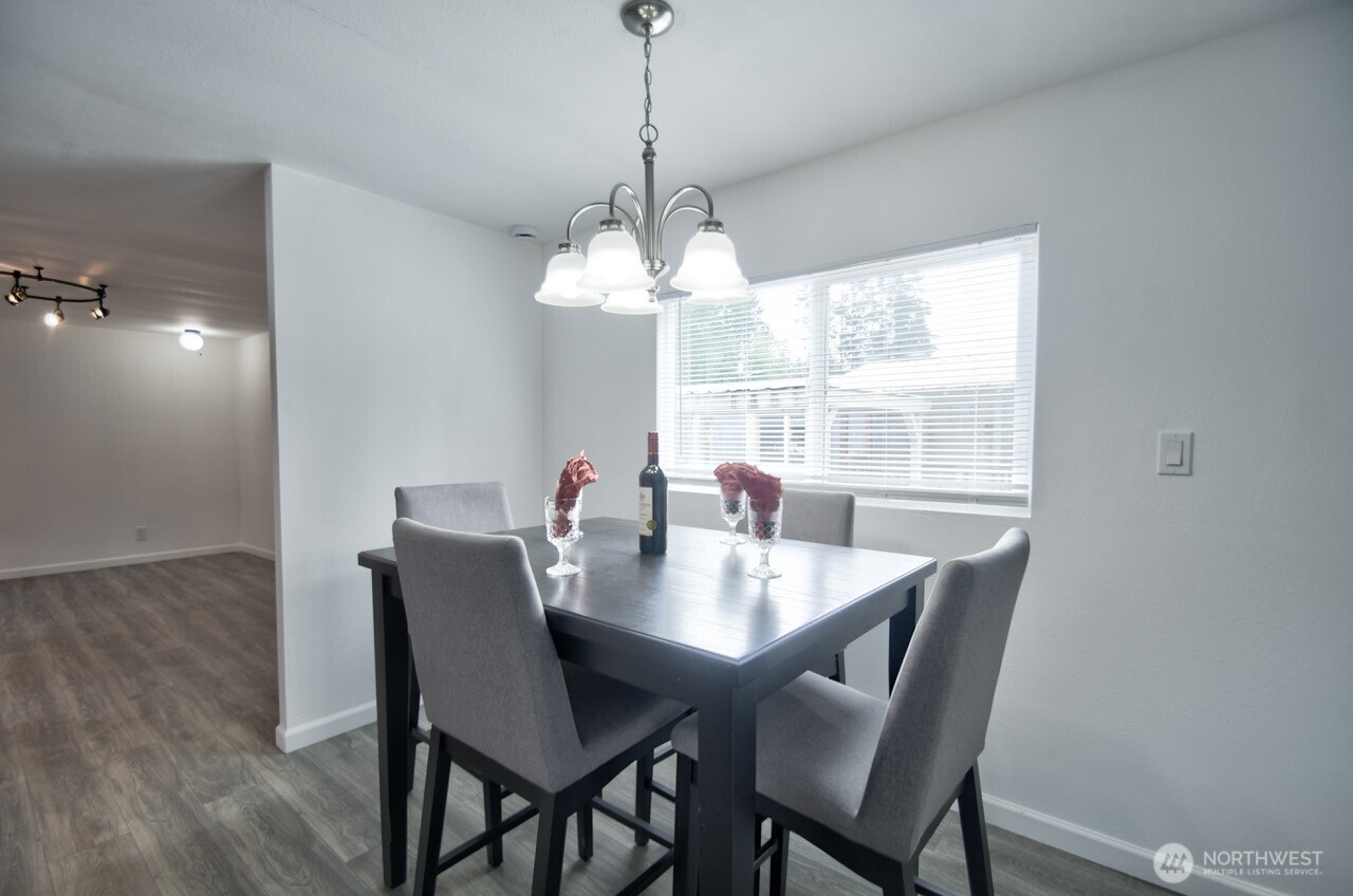 15503 Cedar Park Road Southeast, Unit 14 Olalla, WA 98359 - Photo 6 of 14 a view of a dining room with a table and chairs