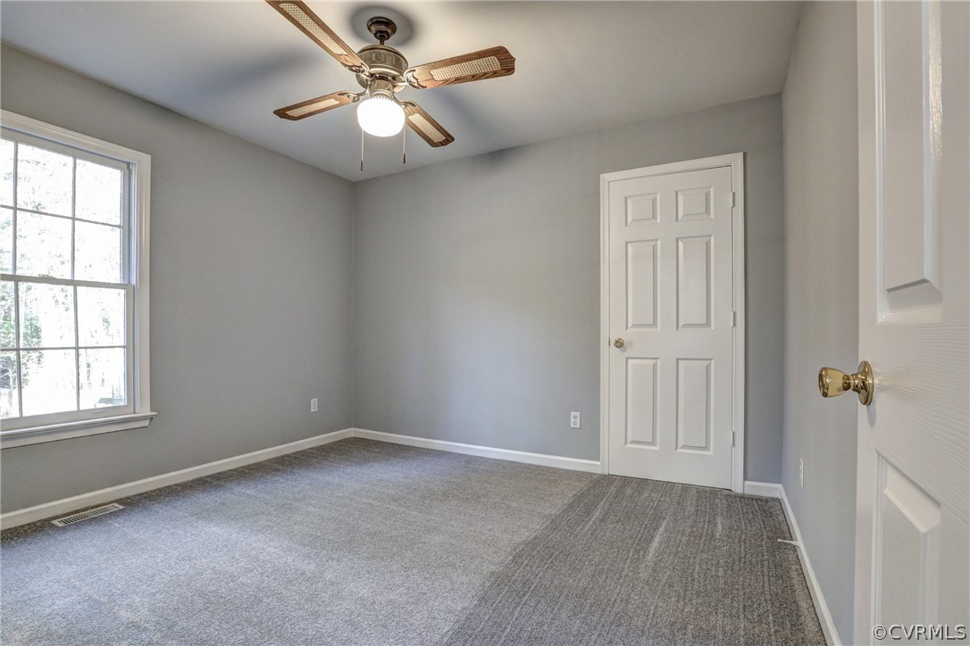 2330 Brookforest Road Midlothian, VA 23112 - Photo 12 of 31 an empty room with windows and fan