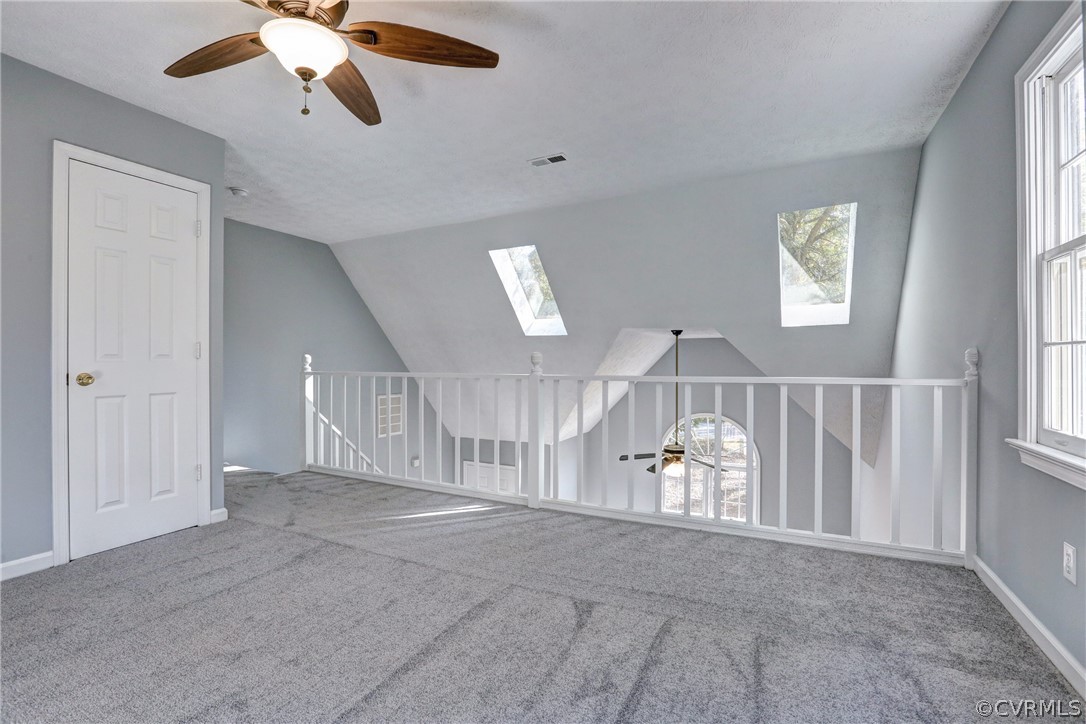 2330 Brookforest Road Midlothian, VA 23112 - Photo 19 of 31 en empty room with windows and ceiling fan