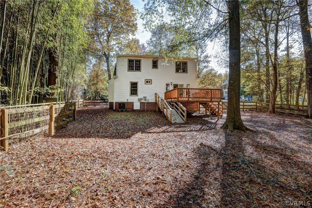 2330 Brookforest Road Midlothian, VA 23112 - Photo 29 of 31 a view of a backyard with large trees and wooden fence