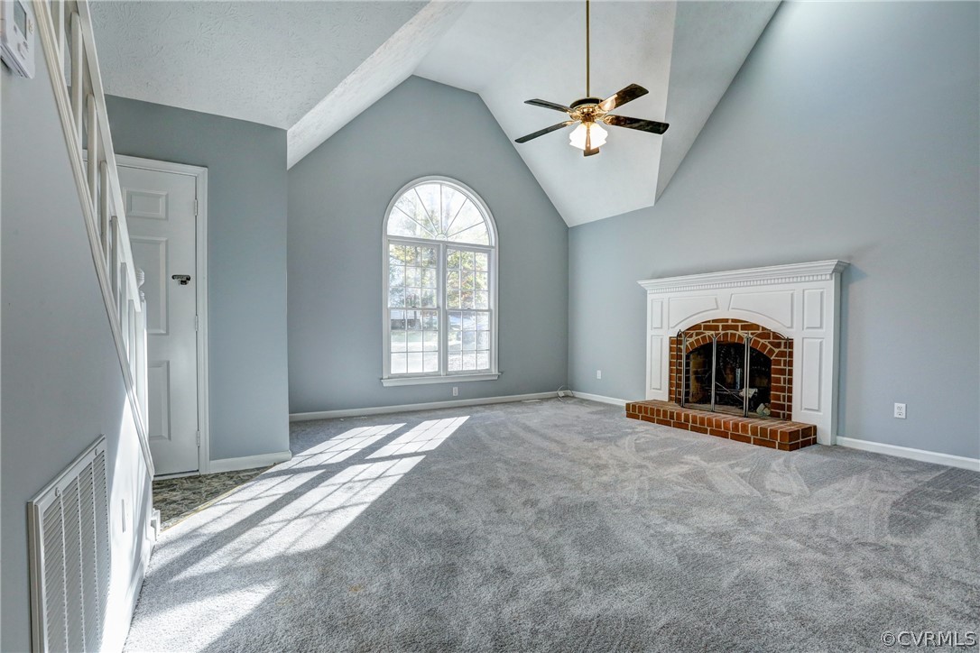 2330 Brookforest Road Midlothian, VA 23112 - Photo 8 of 31 an empty room with a fireplace and large windows