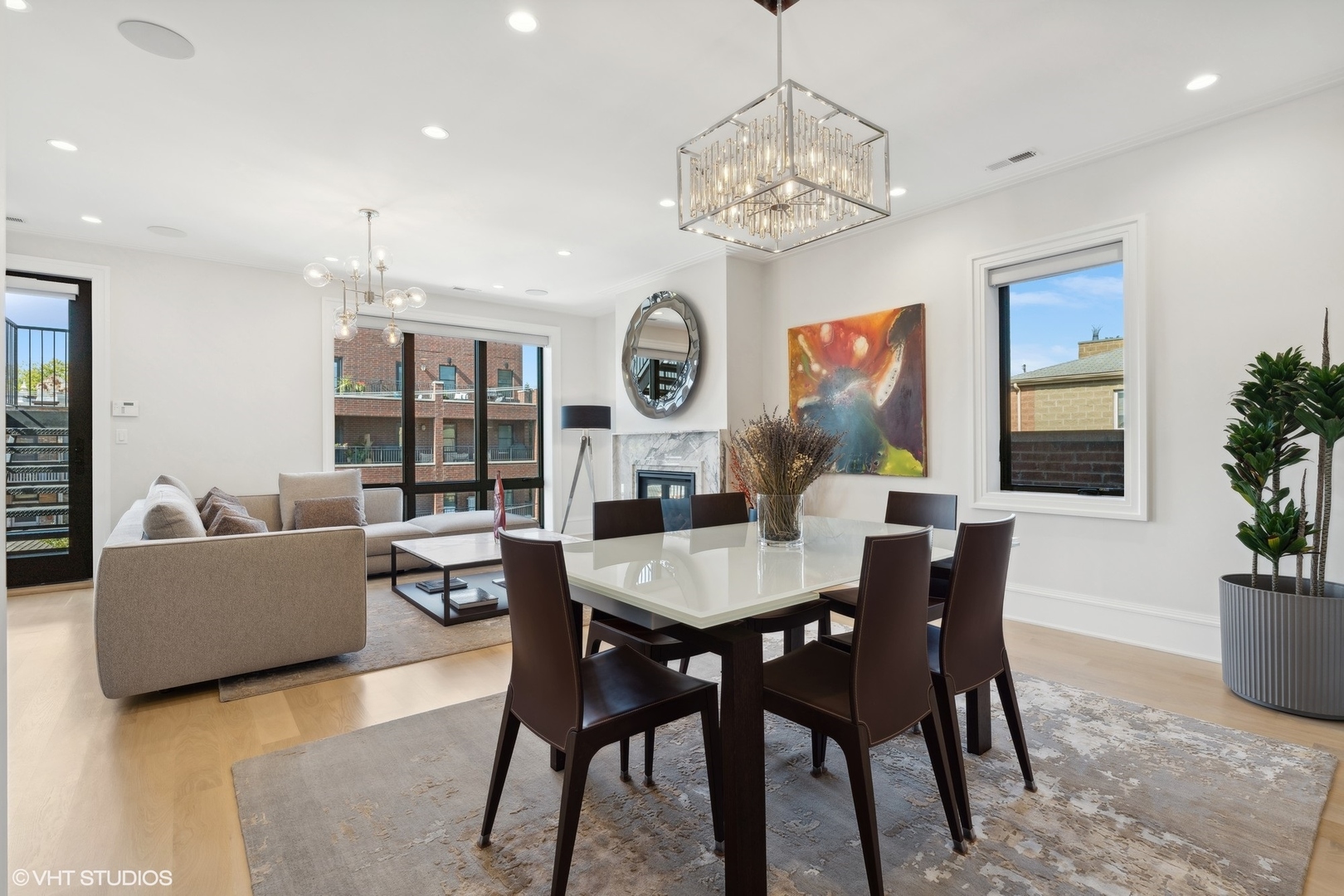 1940 North Mohawk Street, Unit 3 Chicago, IL 60614 - Photo 14 of 33 a view of a dining room with furniture a chandelier and wooden floor