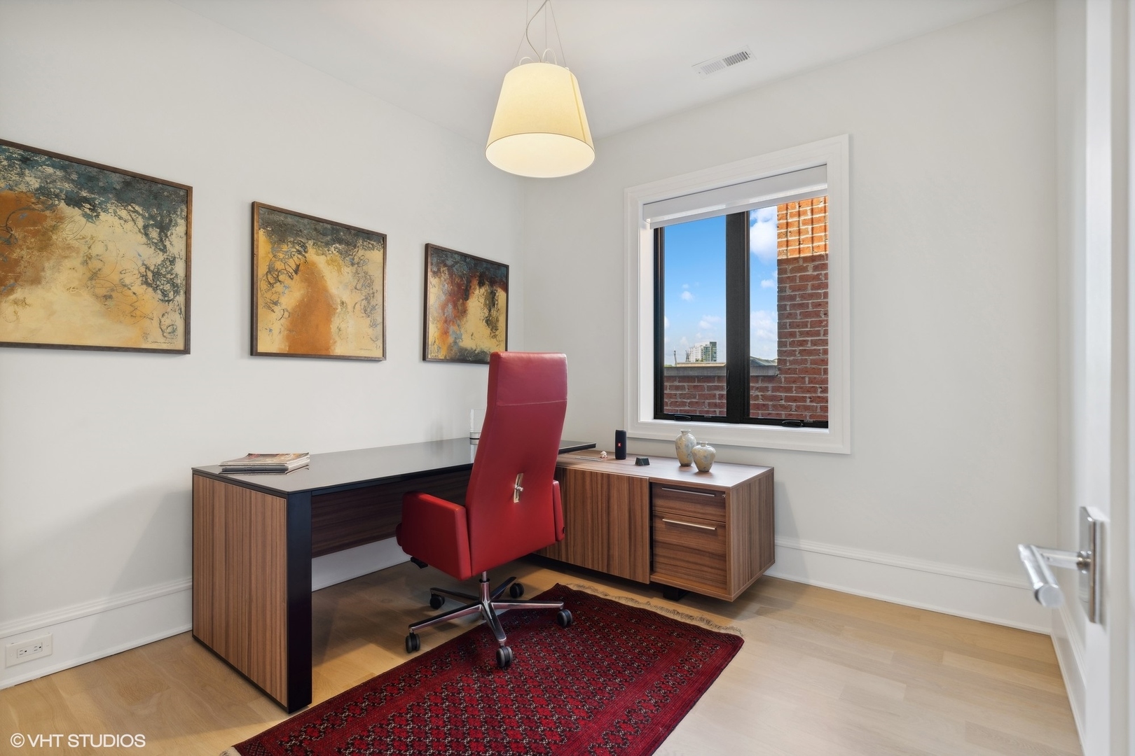 1940 North Mohawk Street, Unit 3 Chicago, IL 60614 - Photo 24 of 33 a view of a workspace with furniture and a window