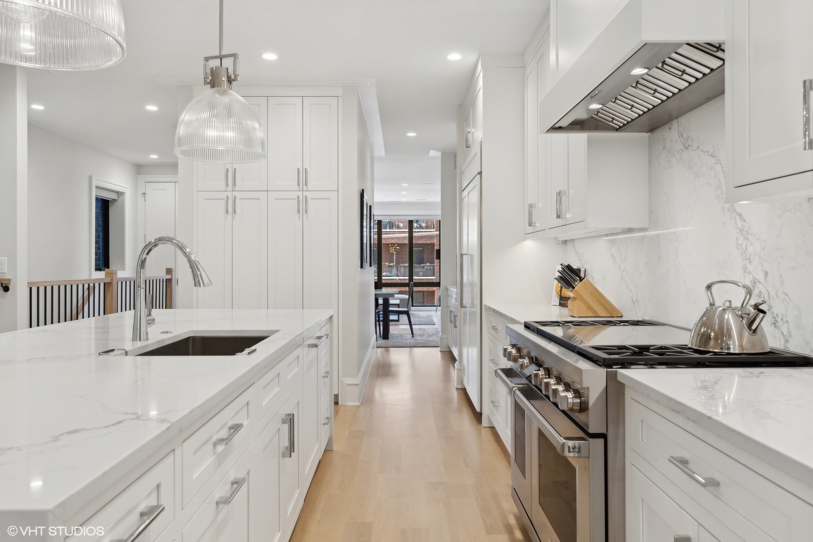 1940 North Mohawk Street, Unit 3 Chicago, IL 60614 - Photo 5 of 33 a kitchen with stainless steel appliances granite countertop a sink stove and cabinets