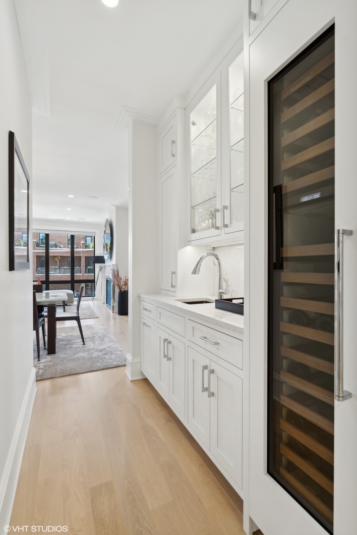 1940 North Mohawk Street, Unit 3 Chicago, IL 60614 - Photo 7 of 33 a spacious bathroom with a granite countertop sink a mirror and shower