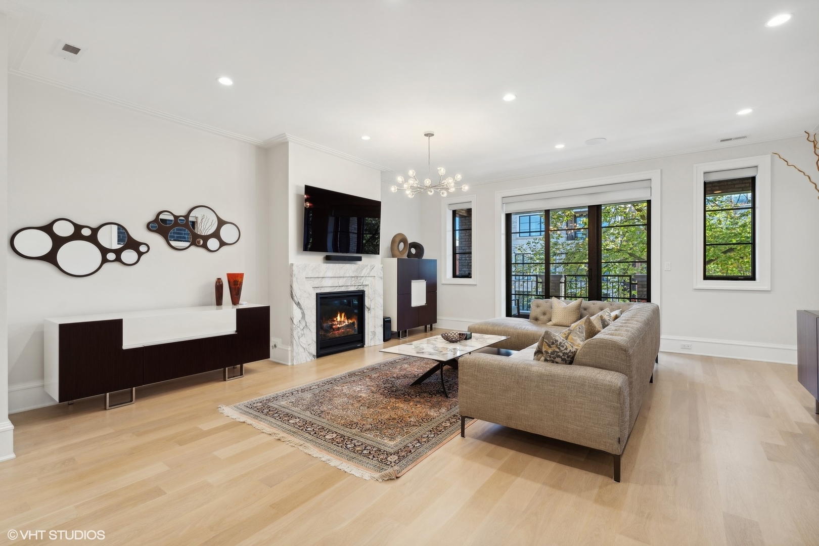 1940 North Mohawk Street, Unit 3 Chicago, IL 60614 - Photo 8 of 33 a living room with furniture a fireplace and a flat screen tv