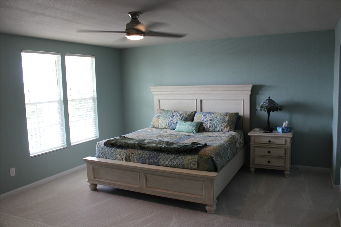 1269 Nevarez Kyle, TX 78640 - Photo 13 of 30 a spacious bedroom with a bed and window