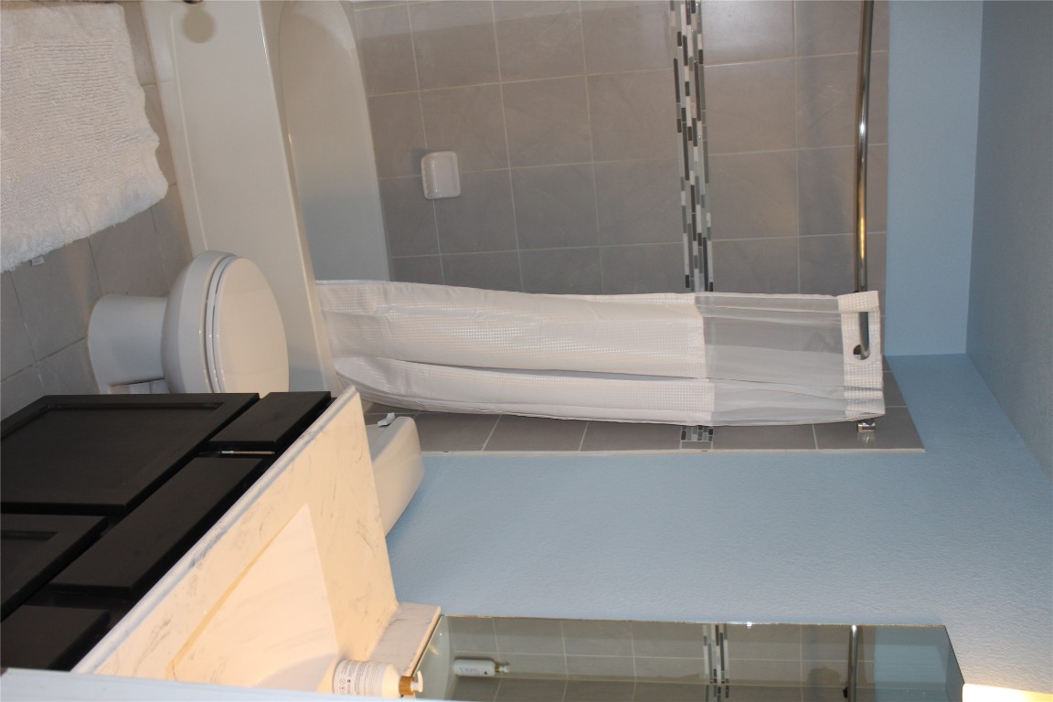 1269 Nevarez Kyle, TX 78640 - Photo 20 of 30 a bathroom with a sink a toilet and shower