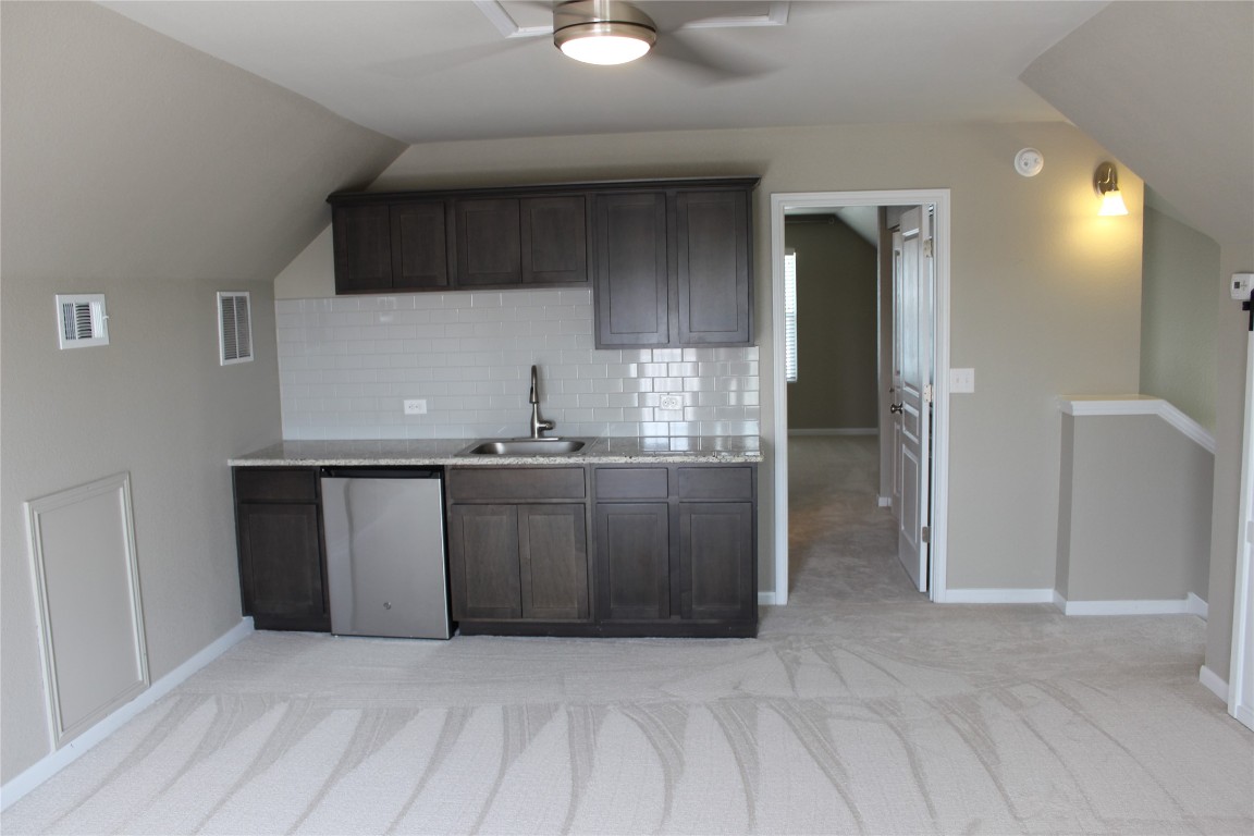 1269 Nevarez Kyle, TX 78640 - Photo 26 of 30 a view of kitchen with granite countertop cabinets and refrigerator