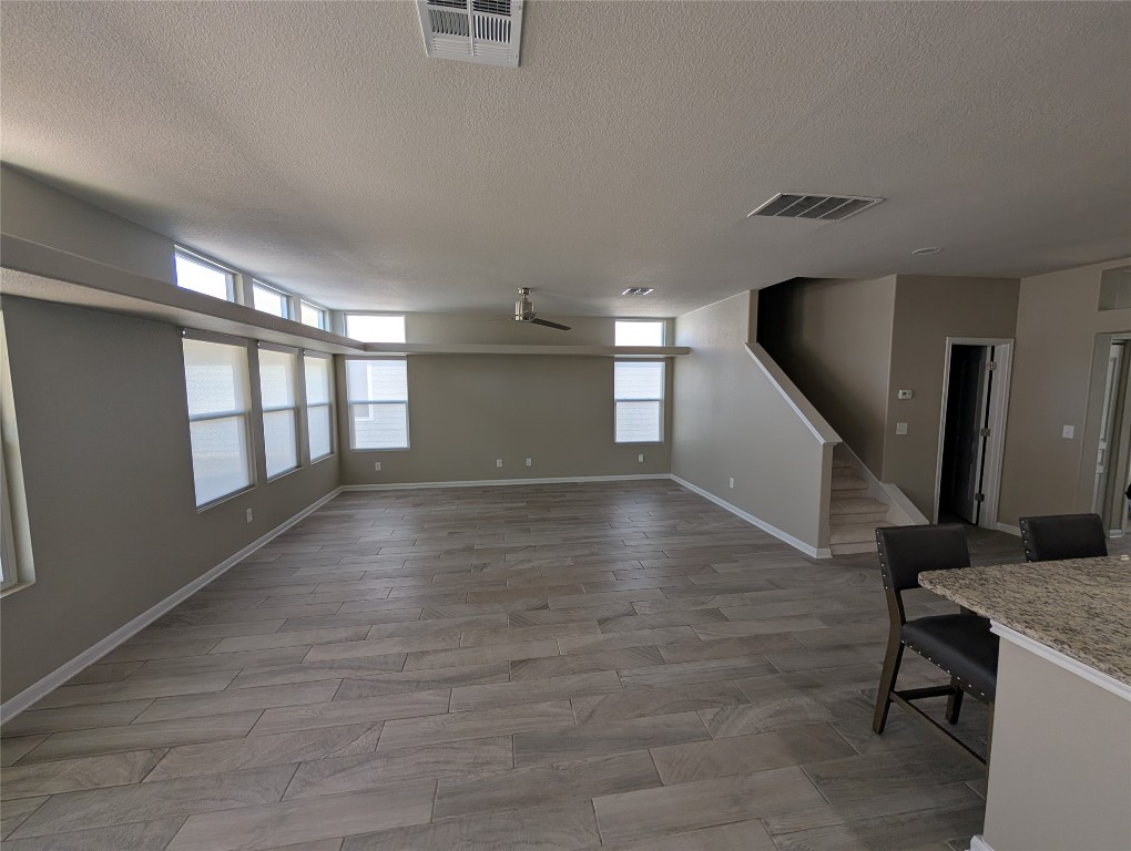 1269 Nevarez Kyle, TX 78640 - Photo 5 of 30 an empty room with wooden floor and windows