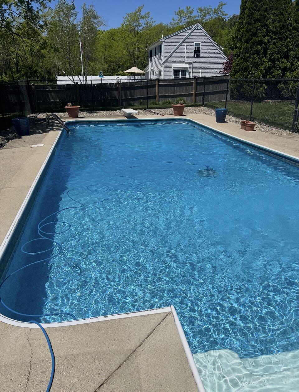 30 Sheffield Place Mashpee, MA 02649 - Photo 32 of 38 a view of a swimming pool with a lounge chair