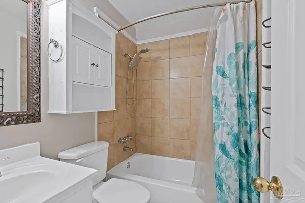 a bathroom with a shower and a toilet