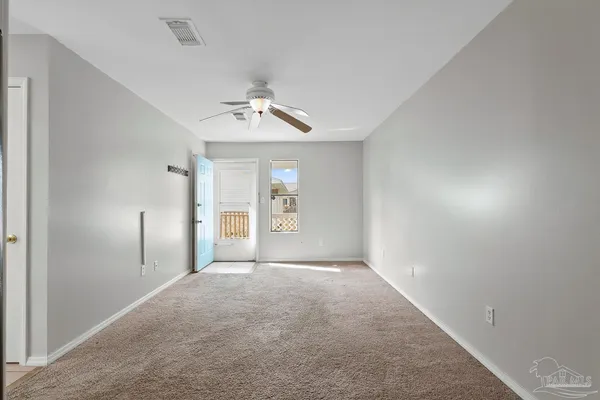 a view of an empty room with a window