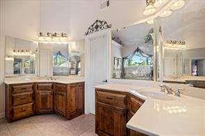 802 Pathview Court Dacula, GA 30019 - Photo 35 of 56 a bathroom with a tub sink and mirror