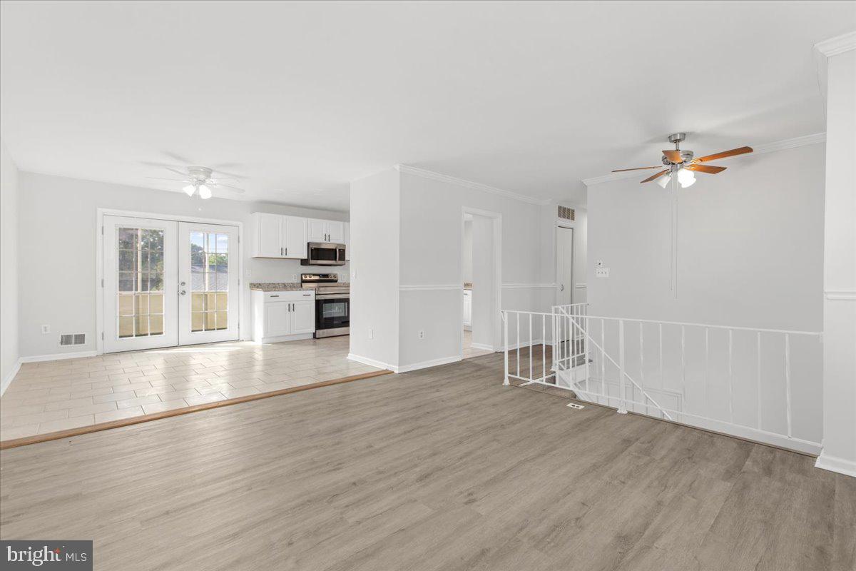 325 Londontown Road Edgewater, MD 21037 - Photo 11 of 34 an empty room with wooden floor and windows