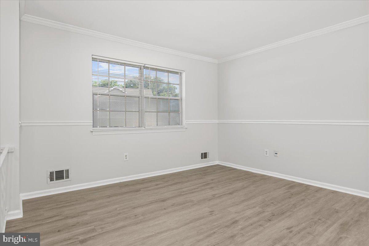 325 Londontown Road Edgewater, MD 21037 - Photo 14 of 34 wooden floor in an empty room with a window