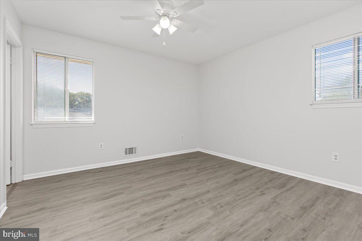 325 Londontown Road Edgewater, MD 21037 - Photo 15 of 34 an empty room with wooden floor and windows