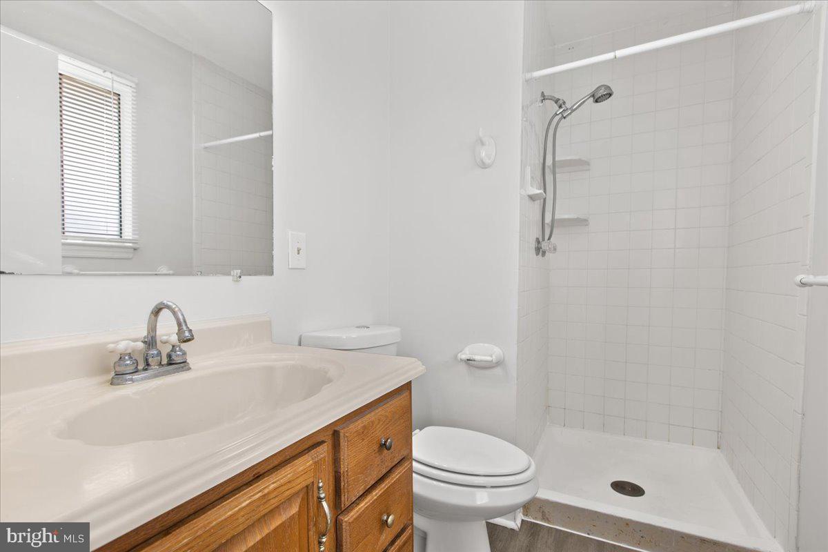 325 Londontown Road Edgewater, MD 21037 - Photo 16 of 34 a bathroom with a sink a toilet and shower