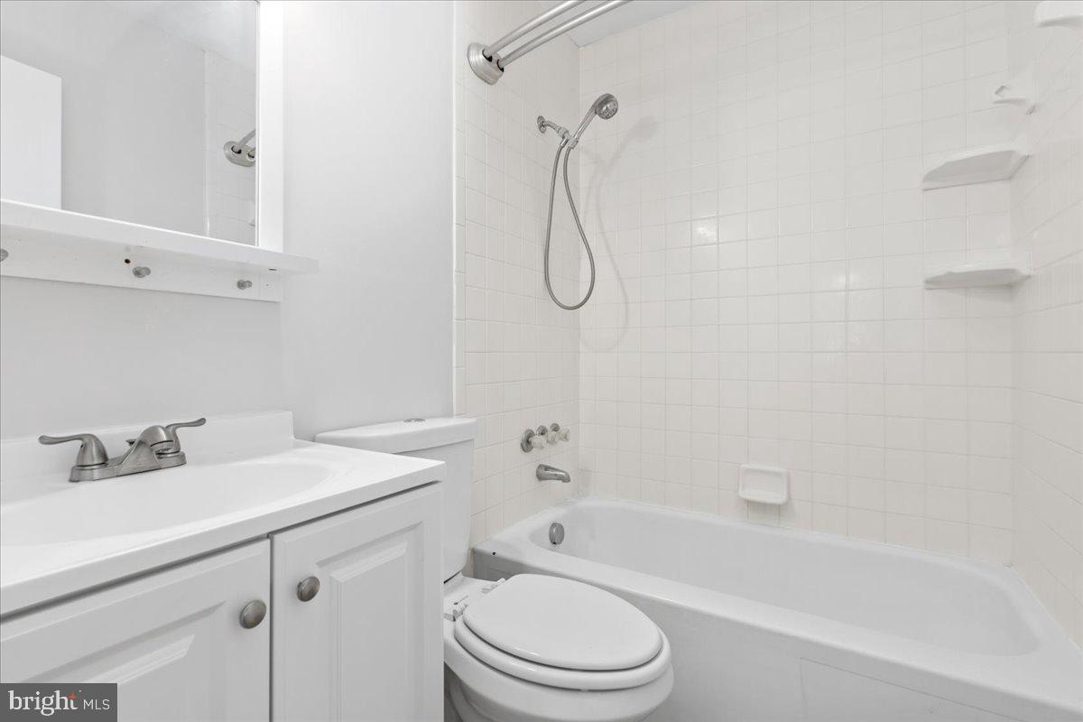 325 Londontown Road Edgewater, MD 21037 - Photo 21 of 34 a bathroom with a sink toilet vanity and shower